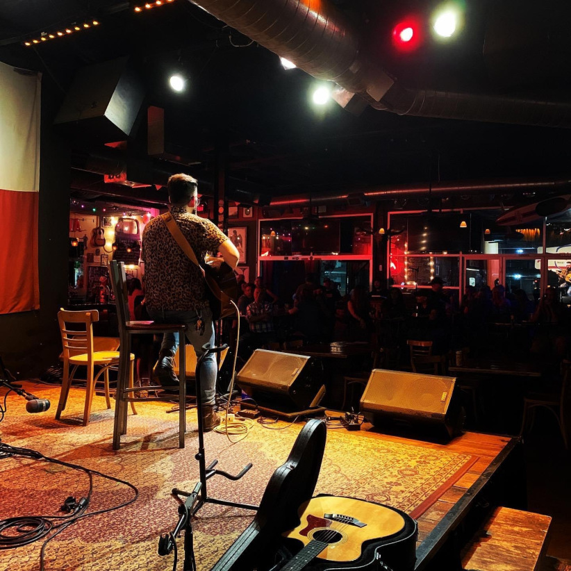 singer microphone spotlight dark